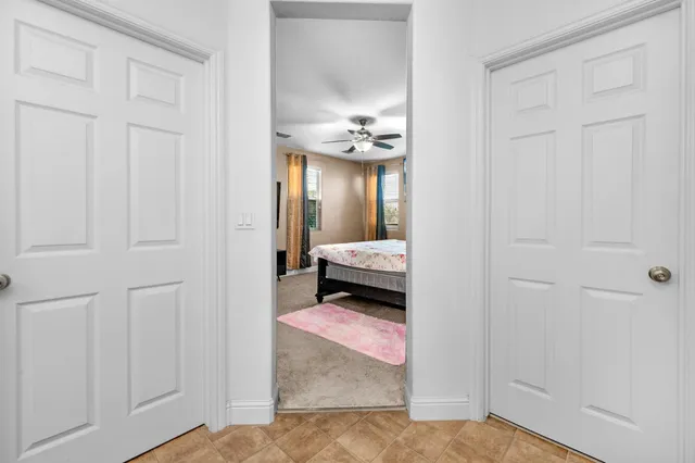 a view of a house with swimming pool and sitting area