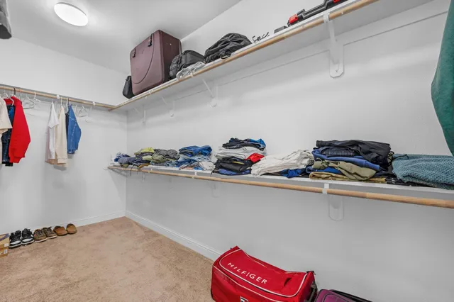 an aerial view of multiple houses with yard