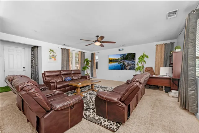 a living room with furniture and a rug