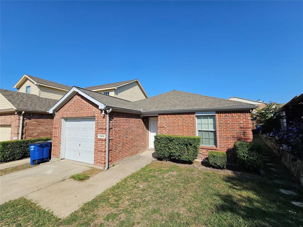17406 Energy Lane Dallas, TX 75252 - Photo 14 of 15 a front view of a house with a yard and garage