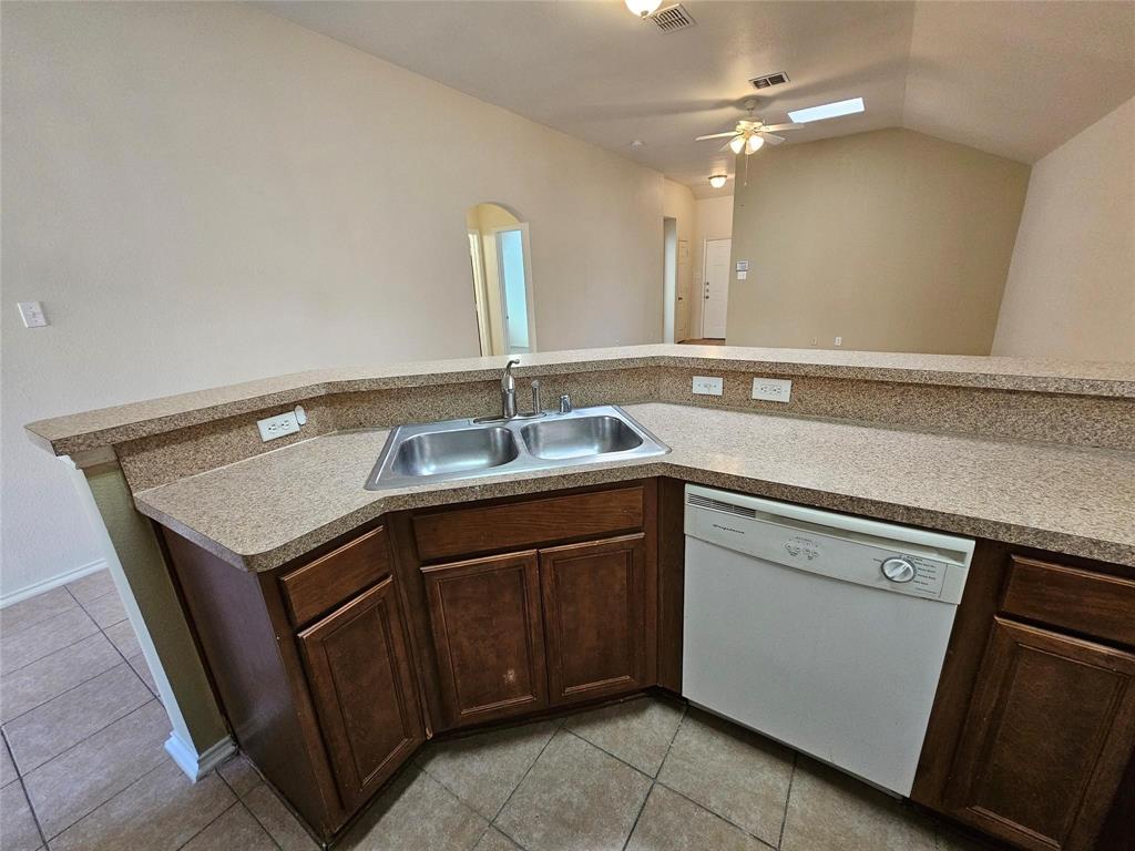 17406 Energy Lane Dallas, TX 75252 - Photo 3 of 15 a kitchen with a sink and cabinets