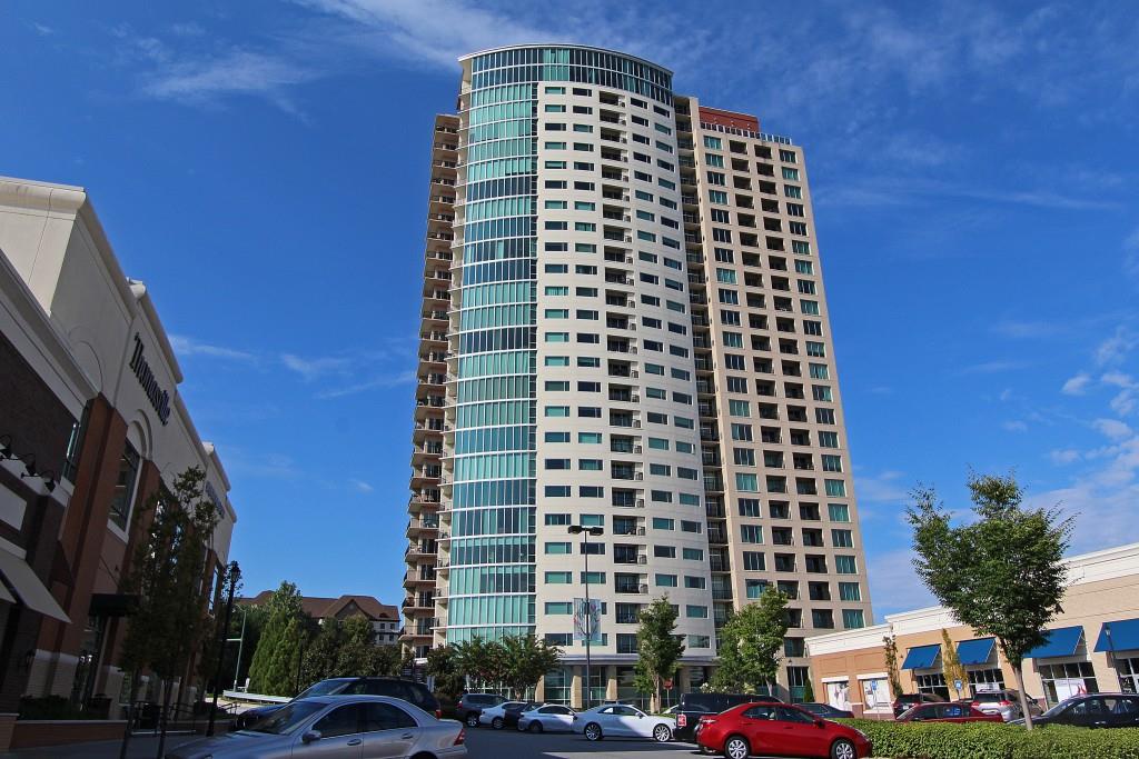 4561 Olde Perimeter Way, Unit 1404 Atlanta, GA 30346 - Photo 1 of 1 a front view of a building with a street