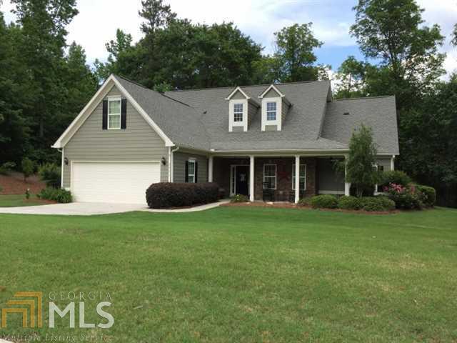 2671 Sleepy Hollow Road, Unit 159 Monroe, GA 30655 - Photo 1 of 1 a front view of a house with a yard