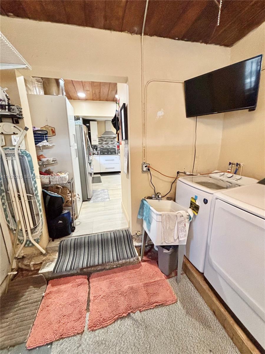 7331 Normandy Street Miramar, FL 33023 - Photo 14 of 29 a view of a bedroom with furniture and a floor to ceiling window