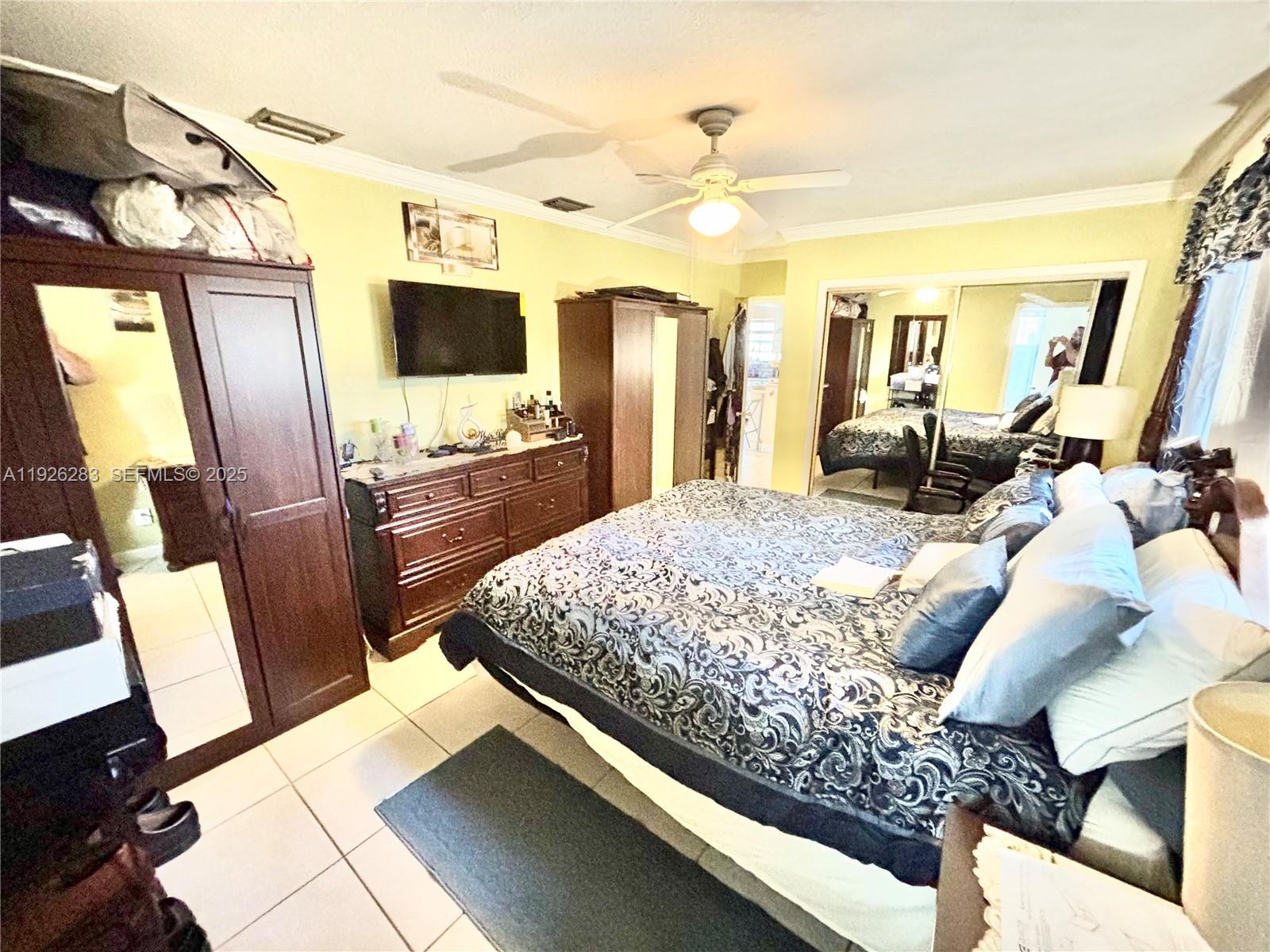 7331 Normandy Street Miramar, FL 33023 - Photo 22 of 29 a living room with large mirror and furniture