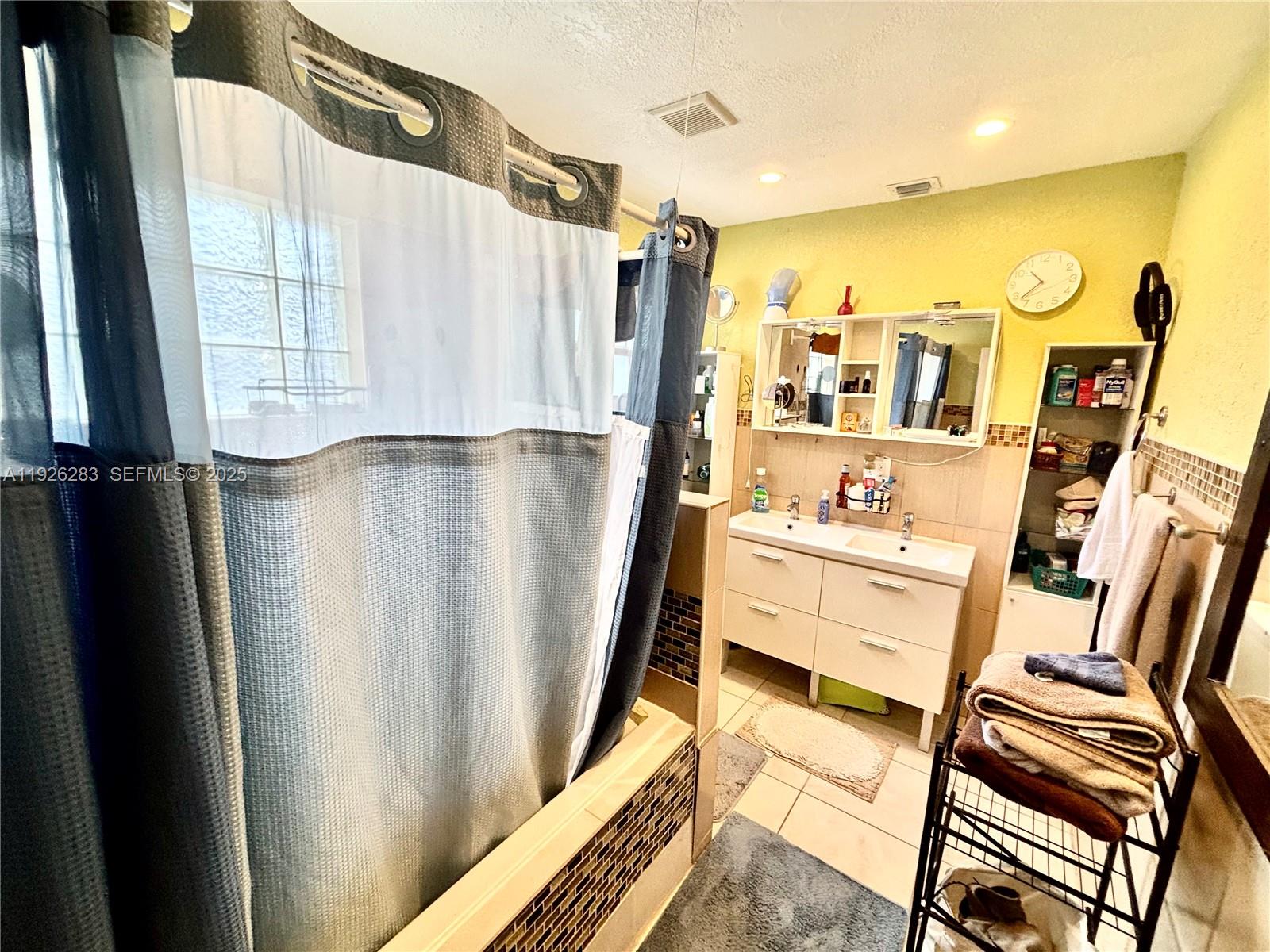 7331 Normandy Street Miramar, FL 33023 - Photo 23 of 29 a view of living room with furniture and a flat screen tv
