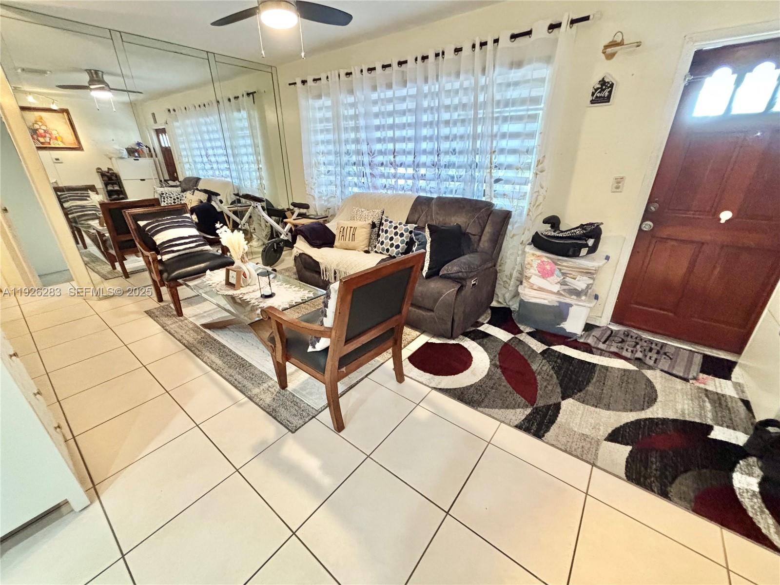 7331 Normandy Street Miramar, FL 33023 - Photo 5 of 29 a dining room with furniture and a rug
