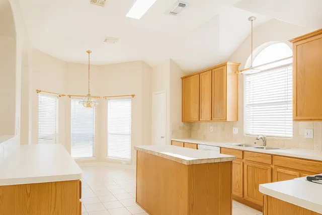a bathroom with a tub sink and a window