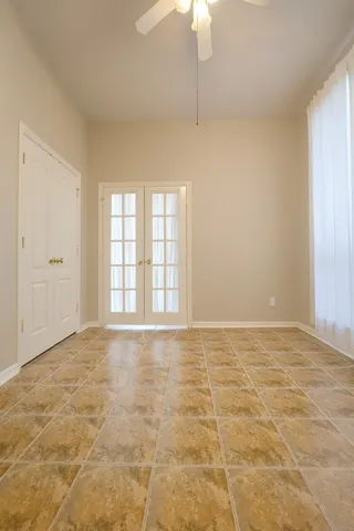 a view of an empty room with a window