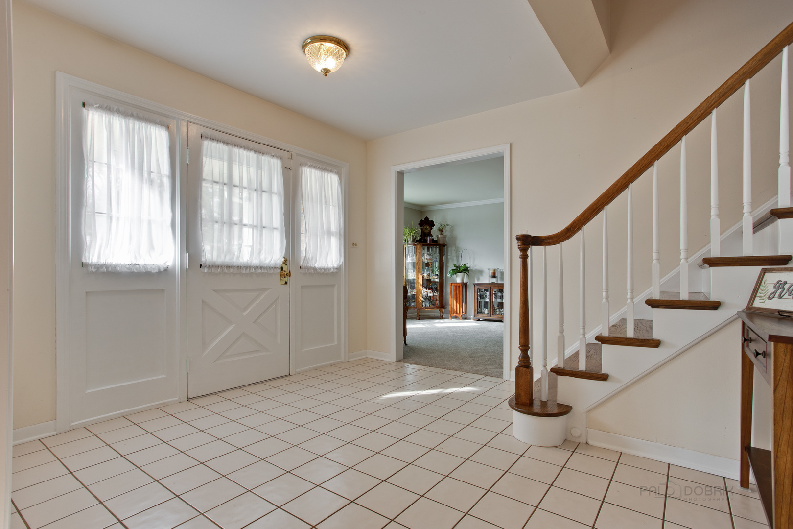 820 Freeman Road Hoffman Estates, IL 60192 - Photo 2 of 33 a view of an entryway with wooden floor and stairs