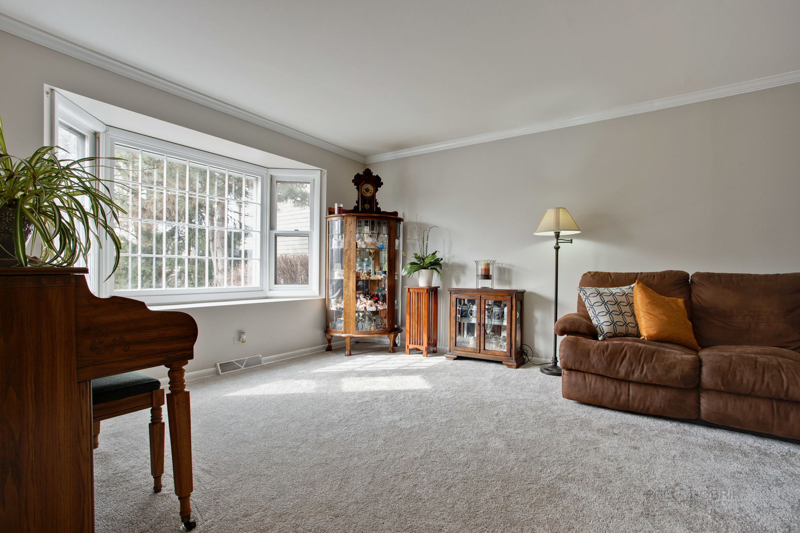820 Freeman Road Hoffman Estates, IL 60192 - Photo 12 of 33 a living room with furniture and a window