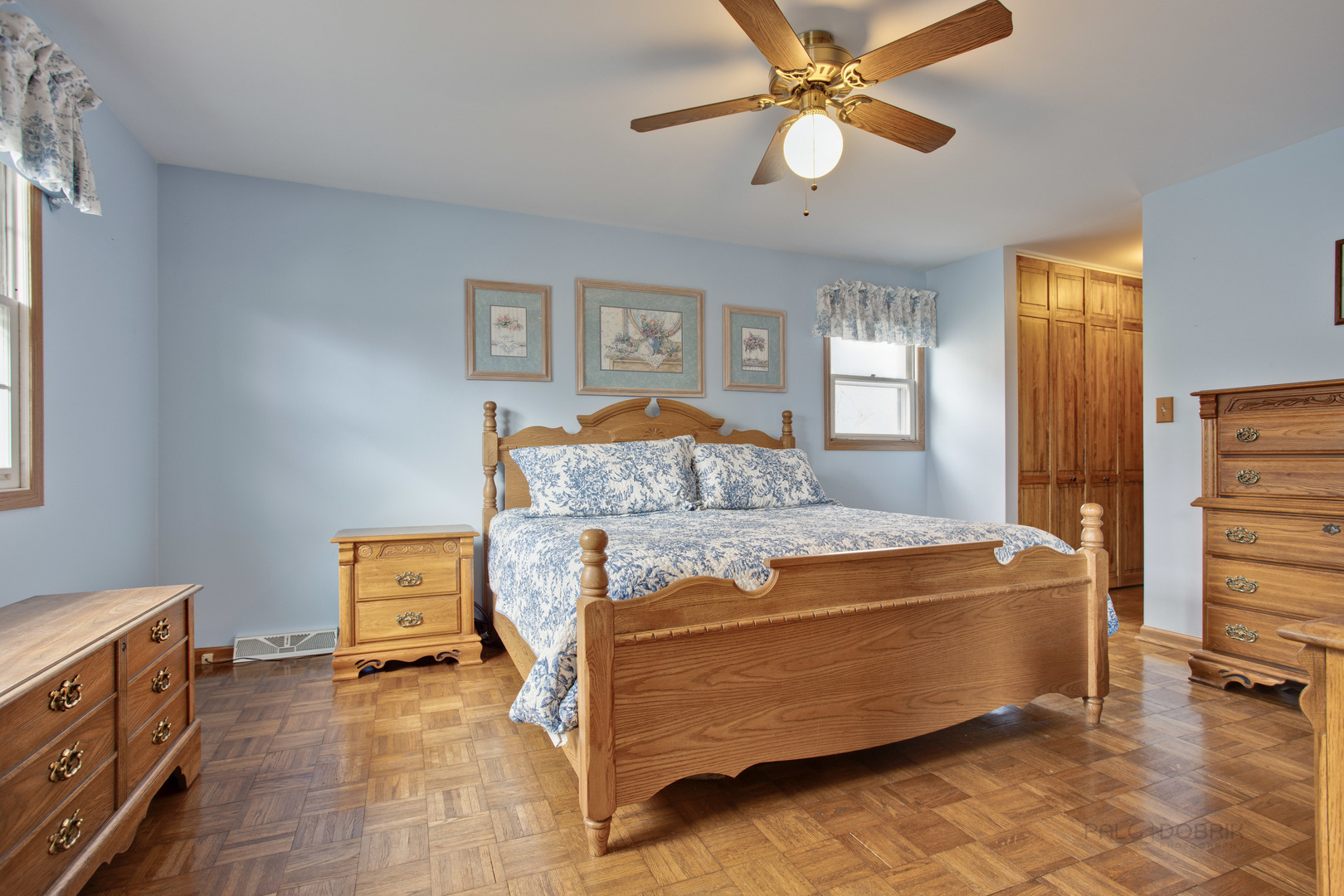 820 Freeman Road Hoffman Estates, IL 60192 - Photo 17 of 33 a bedroom with a bed and a chandelier