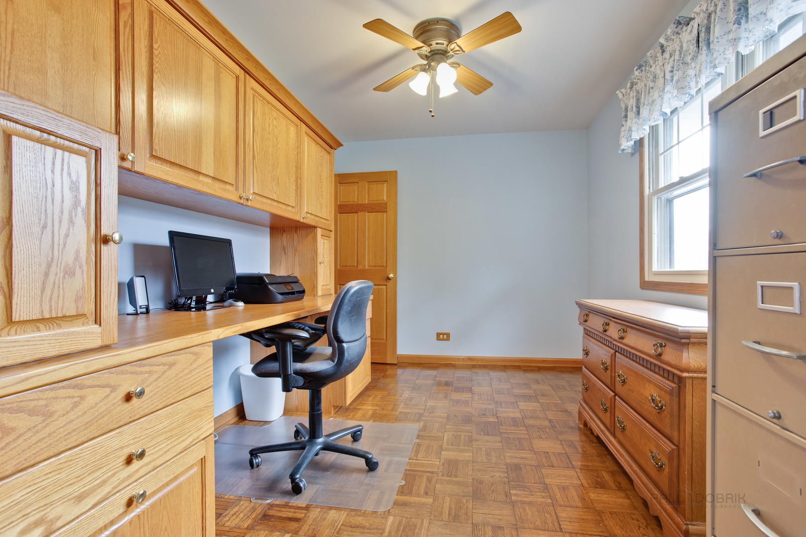 820 Freeman Road Hoffman Estates, IL 60192 - Photo 19 of 33 a view of a workspace with furniture and a window