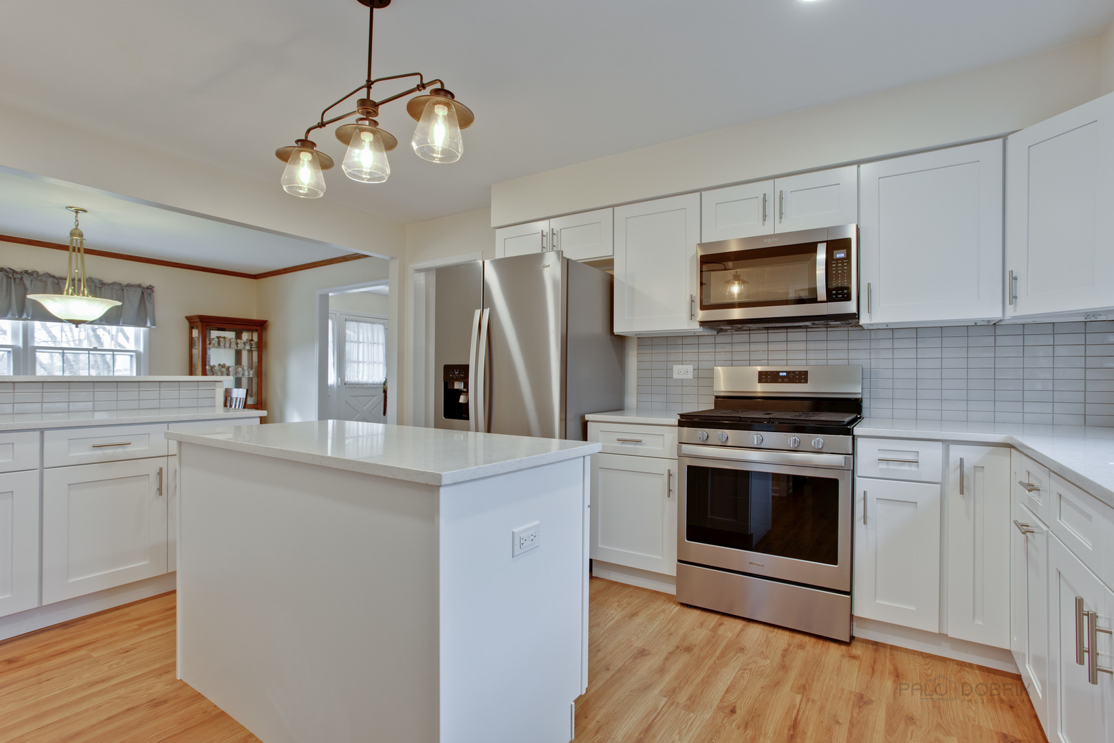 820 Freeman Road Hoffman Estates, IL 60192 - Photo 3 of 33 a kitchen with stainless steel appliances a stove microwave and refrigerator
