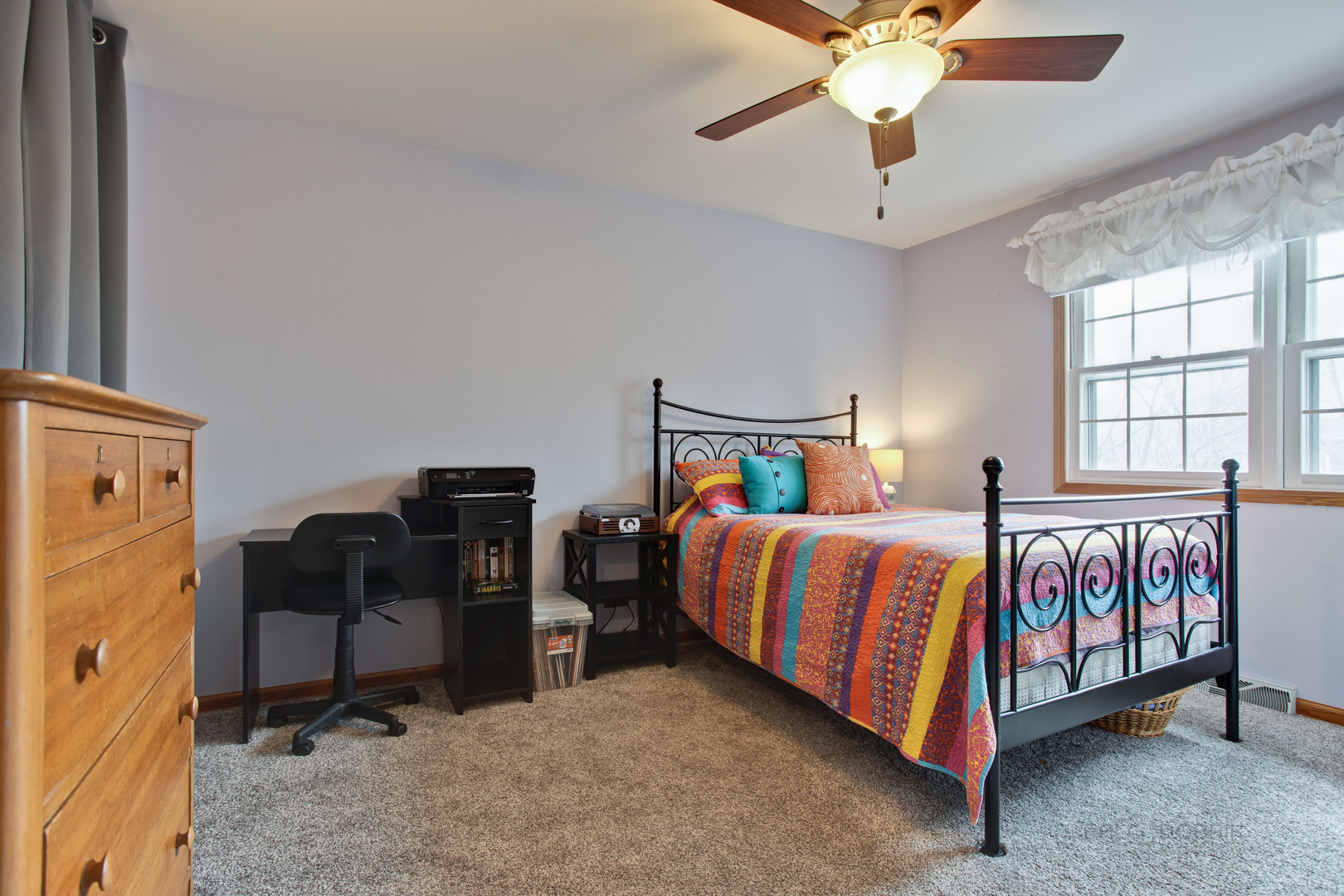 820 Freeman Road Hoffman Estates, IL 60192 - Photo 24 of 33 a bedroom with a bed and a chandelier