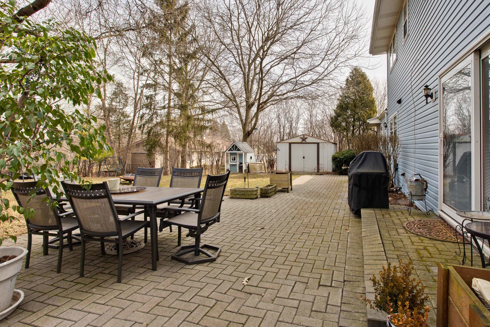 820 Freeman Road Hoffman Estates, IL 60192 - Photo 29 of 33 a view of a patio with table and chairs with wooden fence and floor