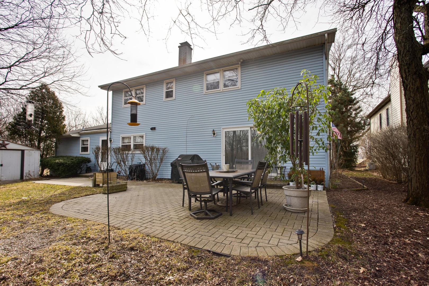 820 Freeman Road Hoffman Estates, IL 60192 - Photo 30 of 33 a view of a patio with a table and chairs under an umbrella