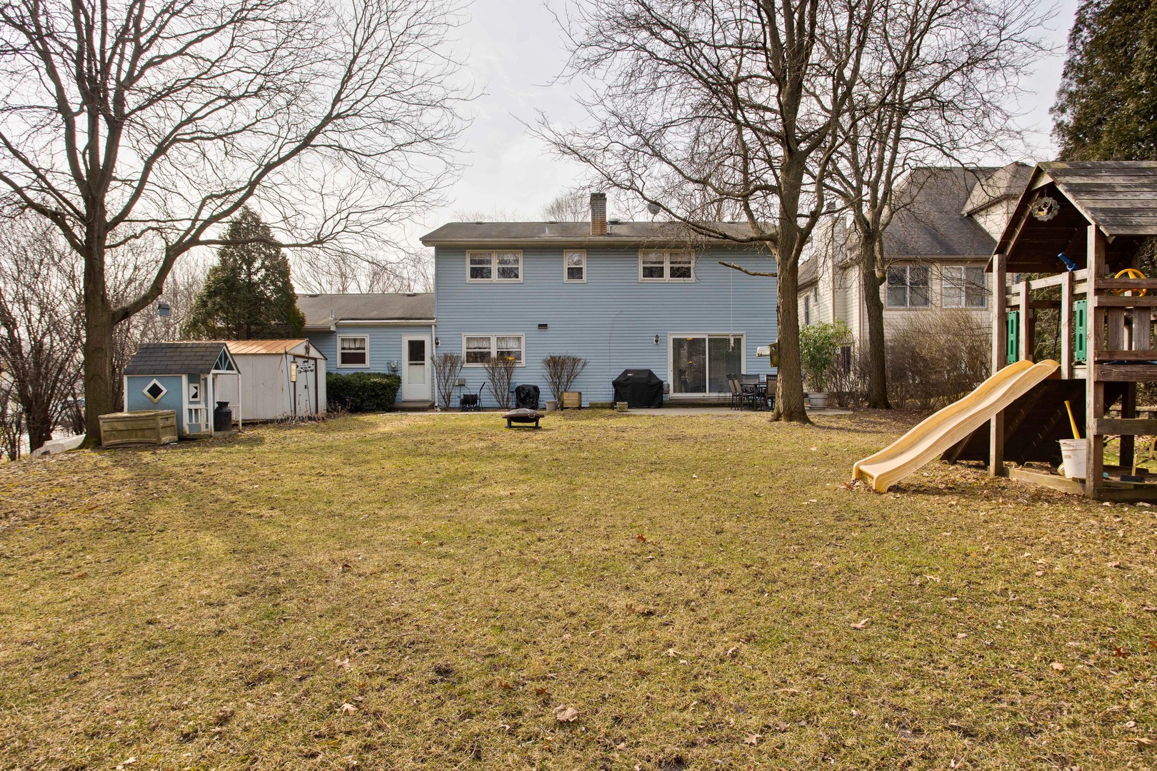 820 Freeman Road Hoffman Estates, IL 60192 - Photo 32 of 33 a view of a house with a yard covered in snow
