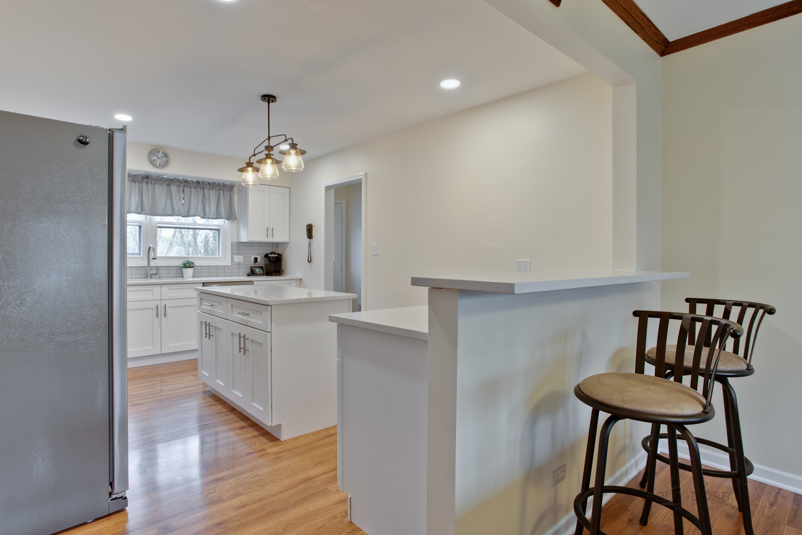 820 Freeman Road Hoffman Estates, IL 60192 - Photo 6 of 33 a kitchen with granite countertop white cabinets and stainless steel appliances