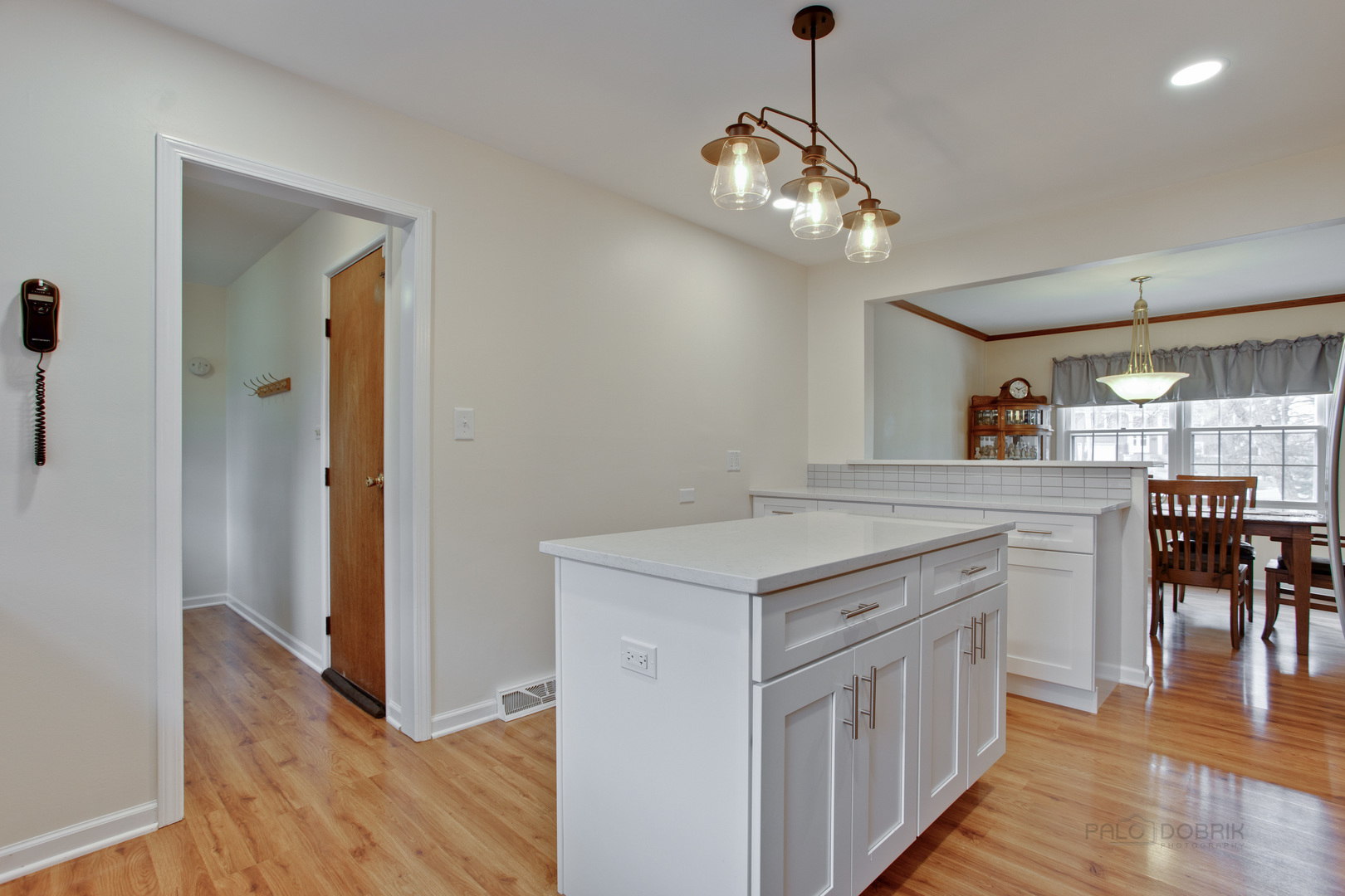 820 Freeman Road Hoffman Estates, IL 60192 - Photo 7 of 33 a kitchen with cabinets and wooden floor