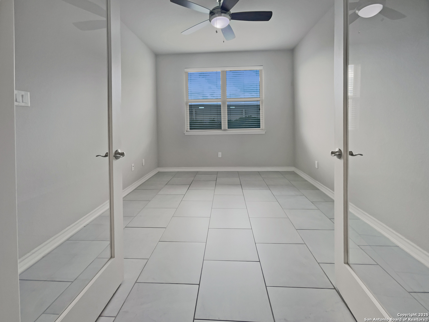23006 Woodlawn Ridge San Antonio, TX 78259 - Photo 12 of 20 a view of an empty room with a window