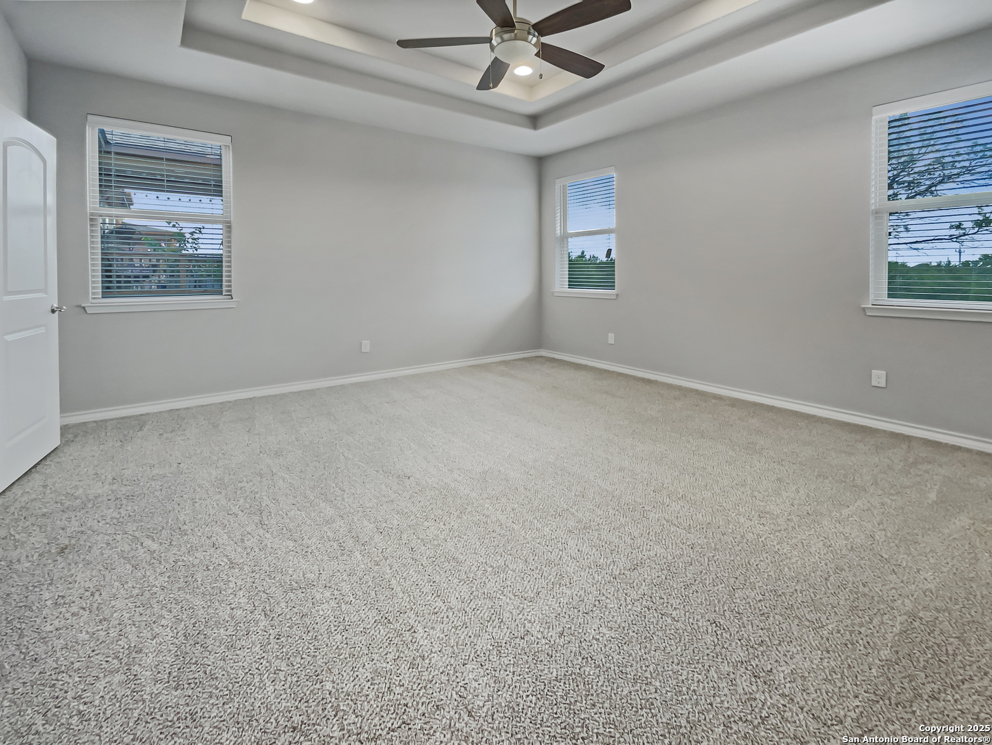 23006 Woodlawn Ridge San Antonio, TX 78259 - Photo 14 of 20 an empty room with windows and fan