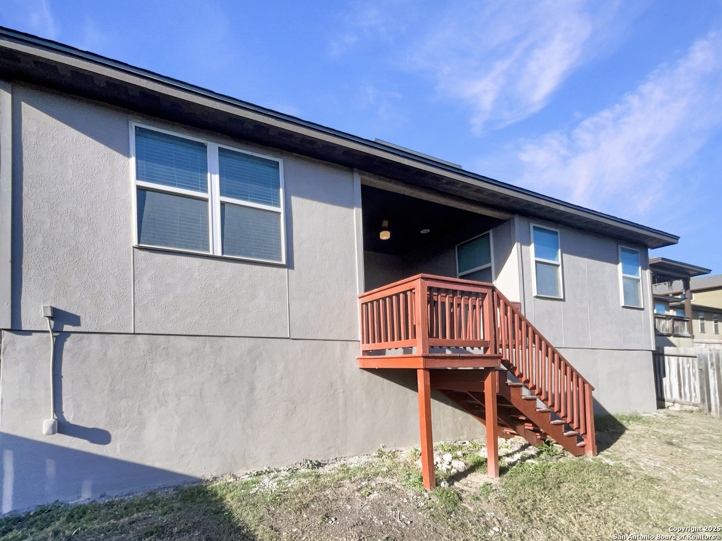 23006 Woodlawn Ridge San Antonio, TX 78259 - Photo 19 of 20 a view of wooden house with a small yard