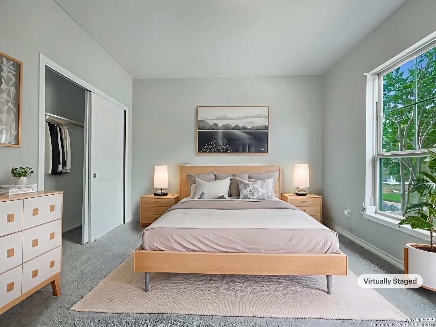 23006 Woodlawn Ridge San Antonio, TX 78259 - Photo 4 of 20 a bedroom with a large bed and a flat tv screen on dresser