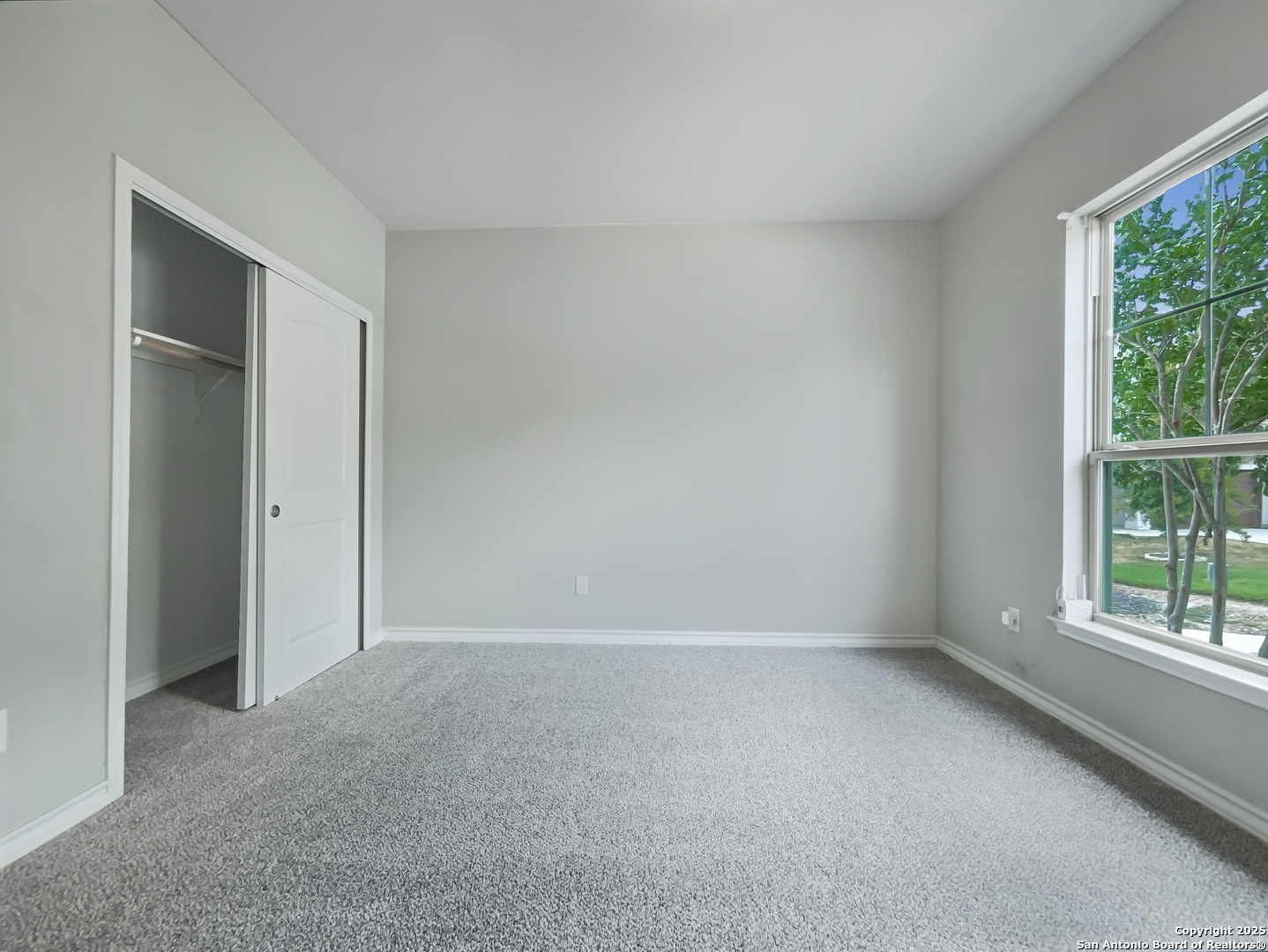 23006 Woodlawn Ridge San Antonio, TX 78259 - Photo 5 of 20 a view of an empty room with a window