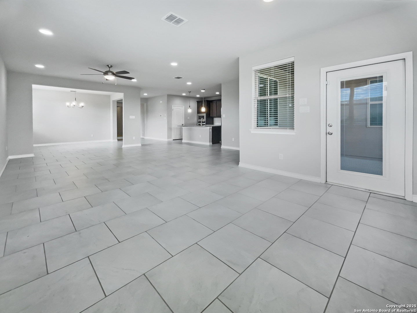 23006 Woodlawn Ridge San Antonio, TX 78259 - Photo 9 of 20 a view of an empty room and a window