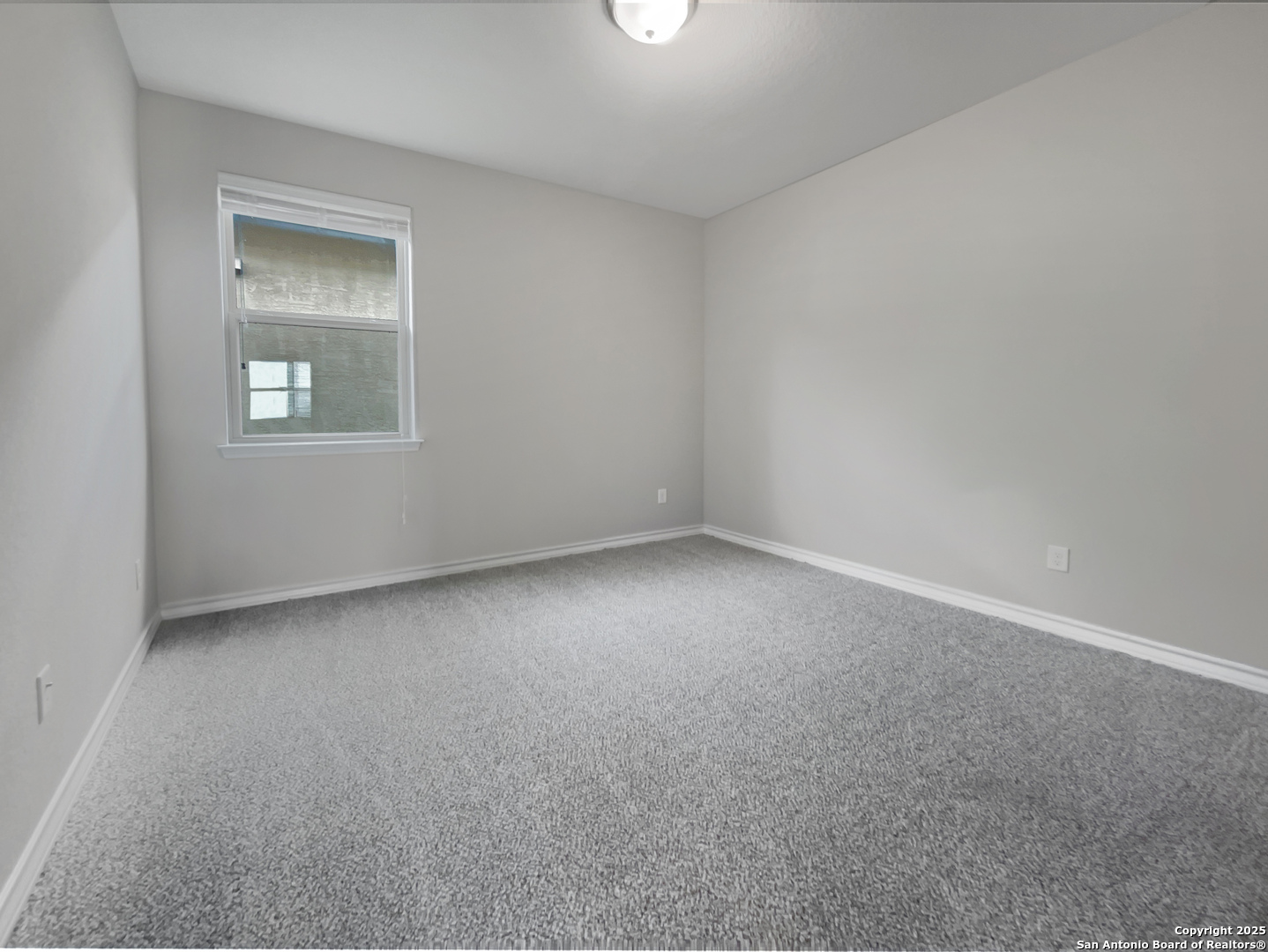 23006 Woodlawn Ridge San Antonio, TX 78259 - Photo 10 of 20 an empty room with a window