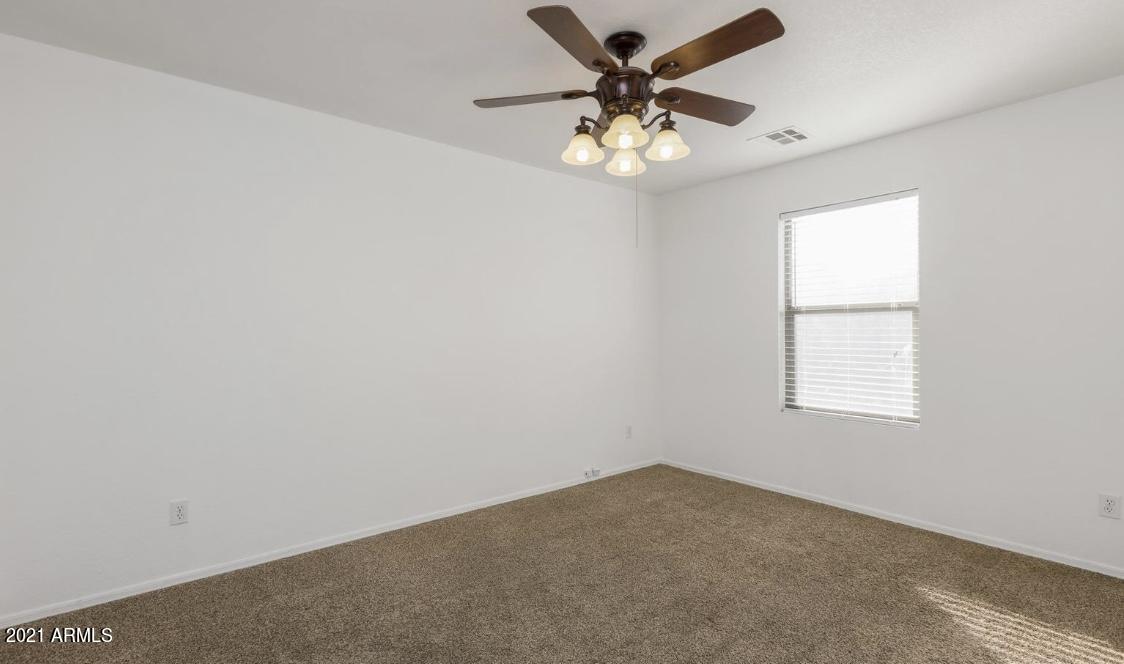 9446 Virginia Avenue Phoenix, AZ 85037 - Photo 15 of 19 an empty room with a window