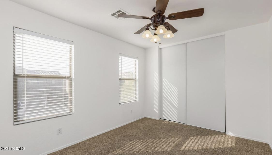 9446 Virginia Avenue Phoenix, AZ 85037 - Photo 17 of 19 a view of an empty room with a window
