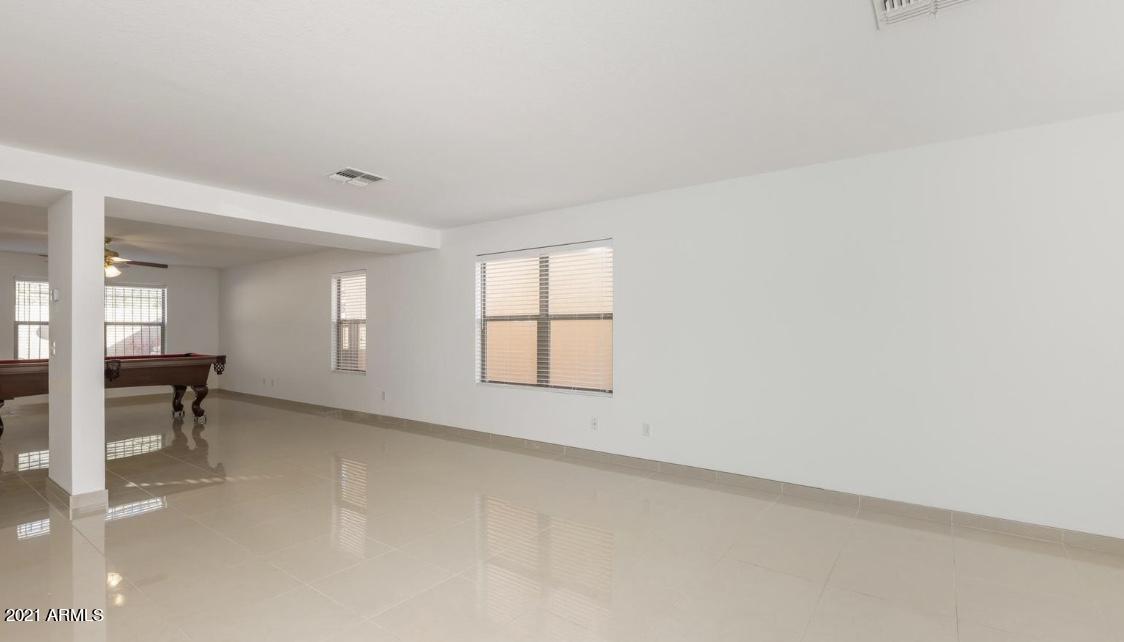 9446 Virginia Avenue Phoenix, AZ 85037 - Photo 3 of 19 an empty room with a window