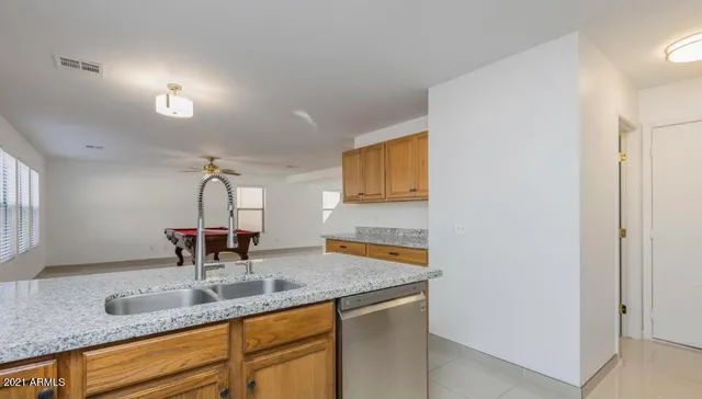 a kitchen with sink and window