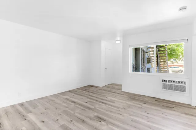 a view of an empty room and window