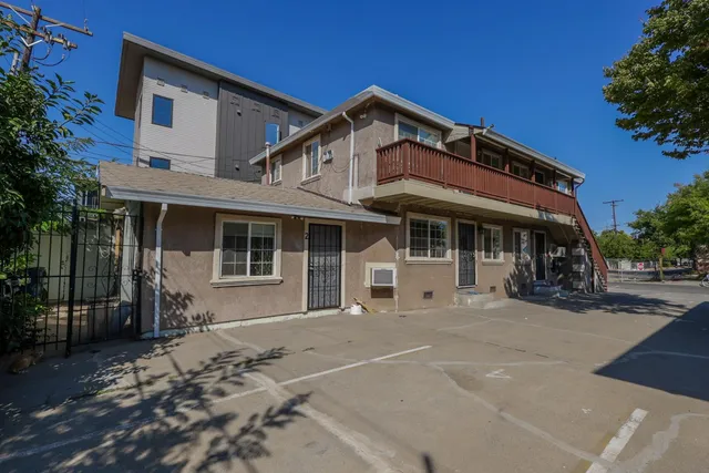 a front view of a house with a sitting area