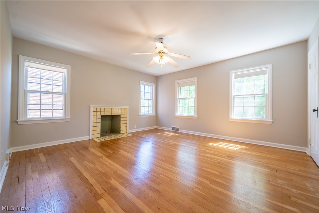 2552 Traymore Road Cleveland, OH 44118 - Photo 17 of 35 The Main Bedroom with hardwood floor and ceramic surround fireplace