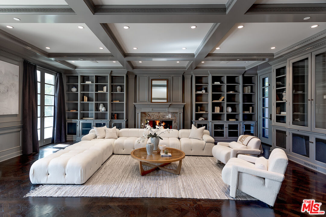 706 North Crescent Drive Beverly Hills, CA 90210 - Photo 12 of 34 a living room with furniture large window and flat screen tv