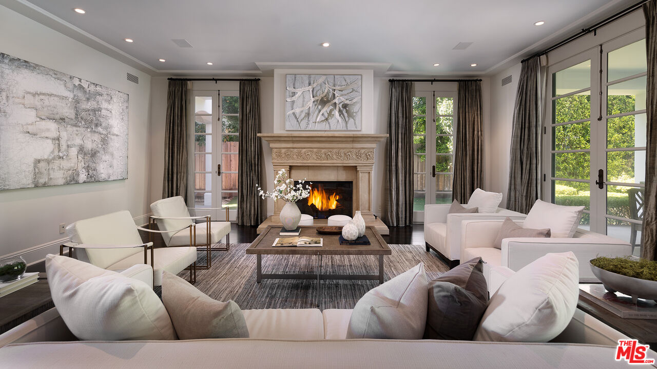706 North Crescent Drive Beverly Hills, CA 90210 - Photo 13 of 34 a living room with furniture and a fireplace