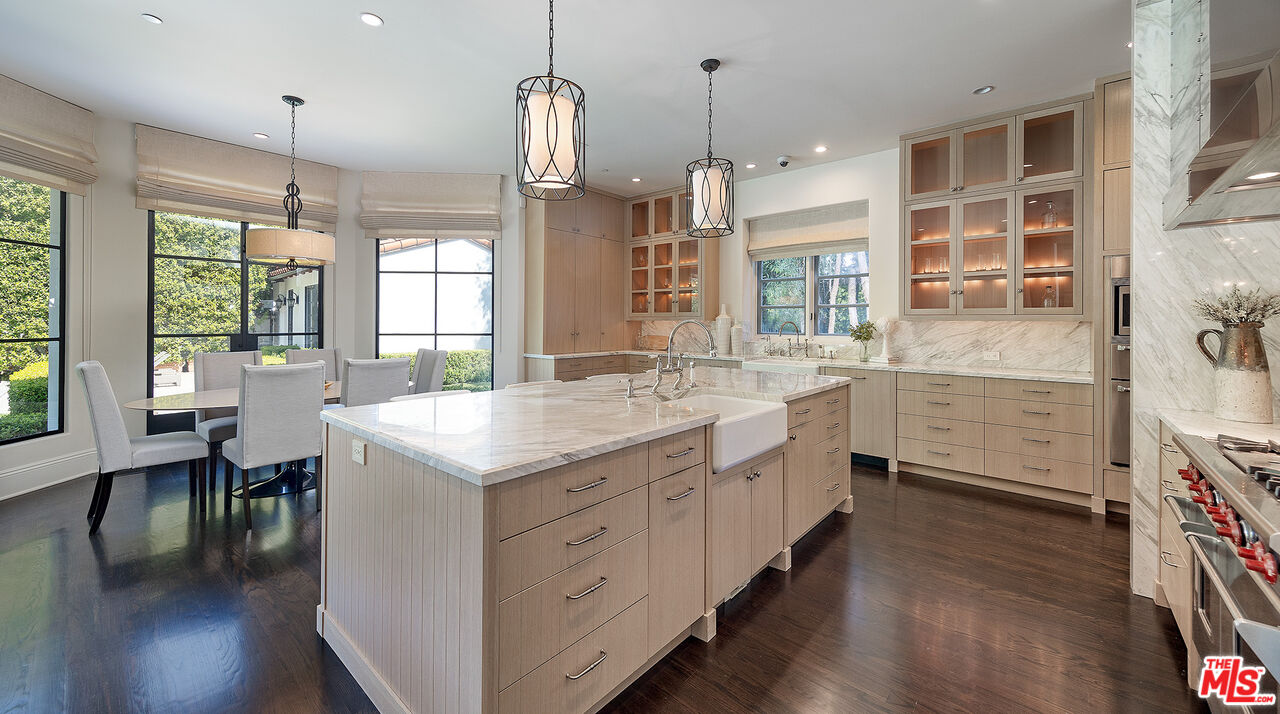 706 North Crescent Drive Beverly Hills, CA 90210 - Photo 15 of 34 a kitchen with counter top space and wooden floor