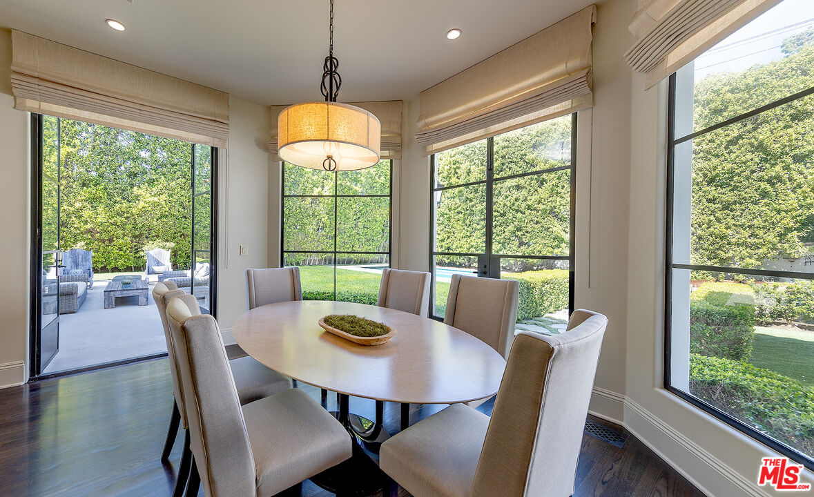 706 North Crescent Drive Beverly Hills, CA 90210 - Photo 17 of 34 a view of a dining room with furniture window and wooden floor