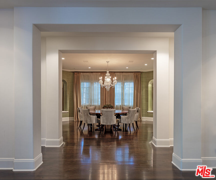 706 North Crescent Drive Beverly Hills, CA 90210 - Photo 18 of 34 a view of a dining room with furniture and wooden floor