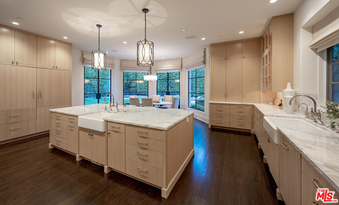 706 North Crescent Drive Beverly Hills, CA 90210 - Photo 31 of 34 a bathroom with a double vanity sink and a mirror