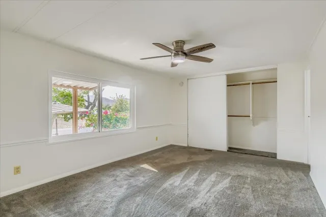 a view of a big room with carpet