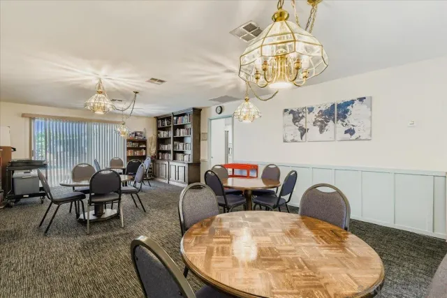 a view of a swimming pool with a yard