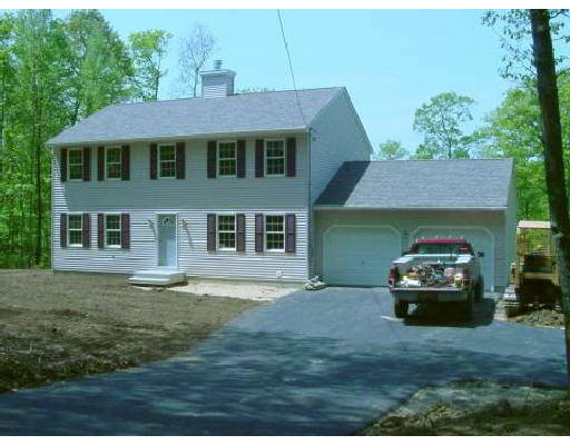 468 Reed Street Warren, MA 01092 - Photo 1 of 1 a front view of a house with a garden