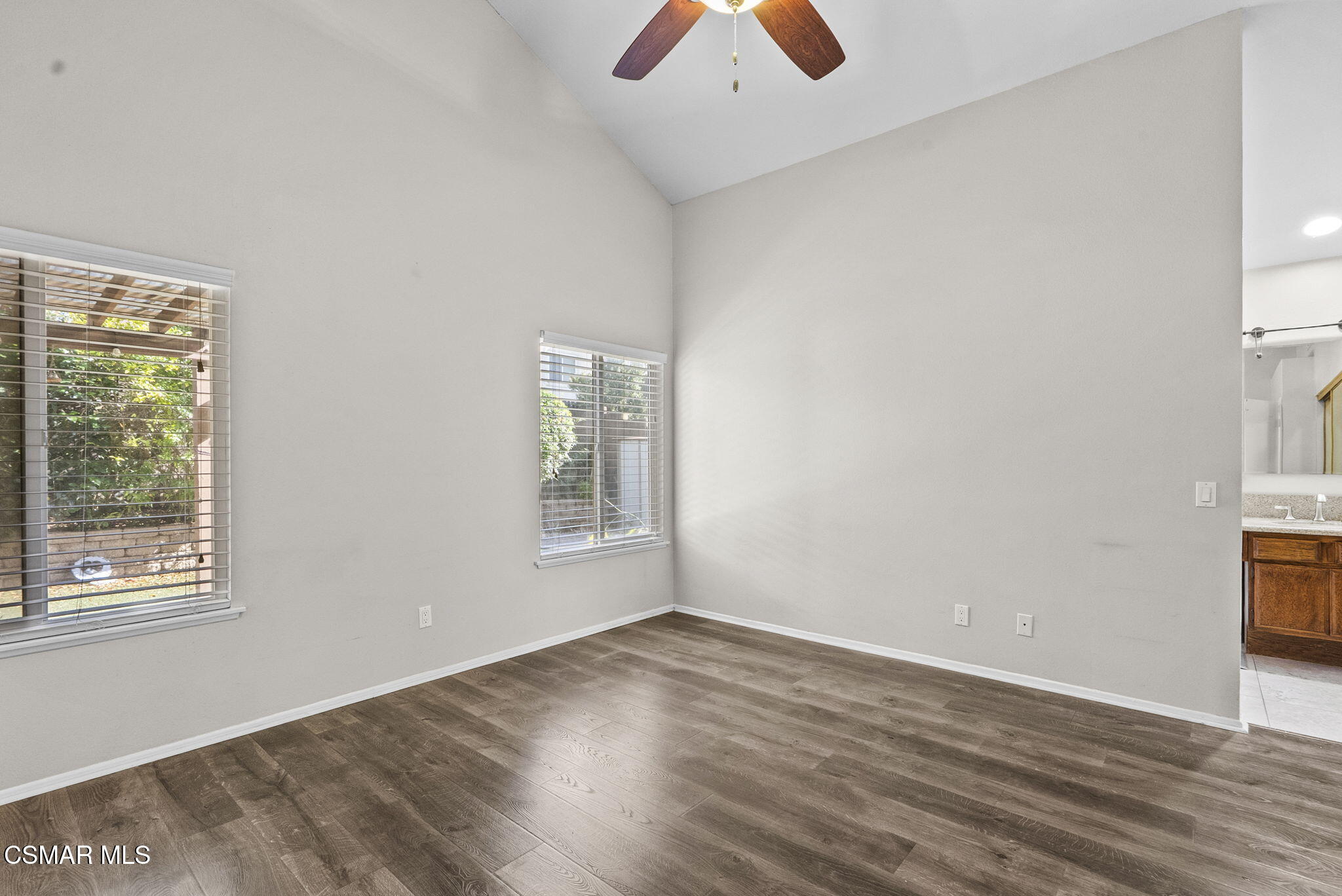 2508 Glenhurst Court Simi Valley, CA 93063 - Photo 22 of 41 an empty room with wooden floor and windows