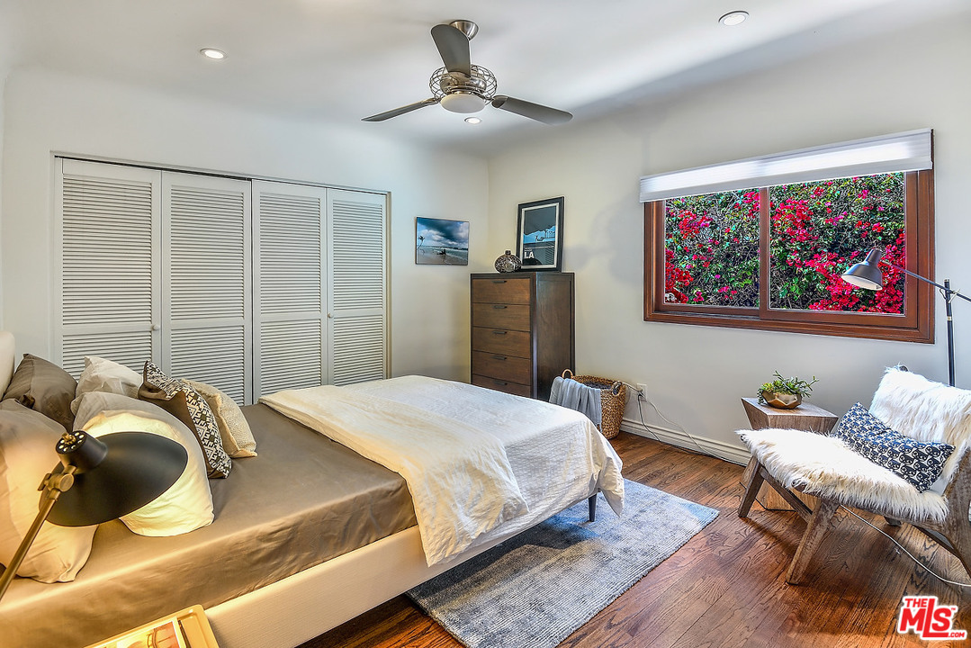 1102 Grant Avenue Venice, CA 90291 - Photo 17 of 29 a bedroom with a bed and a chair