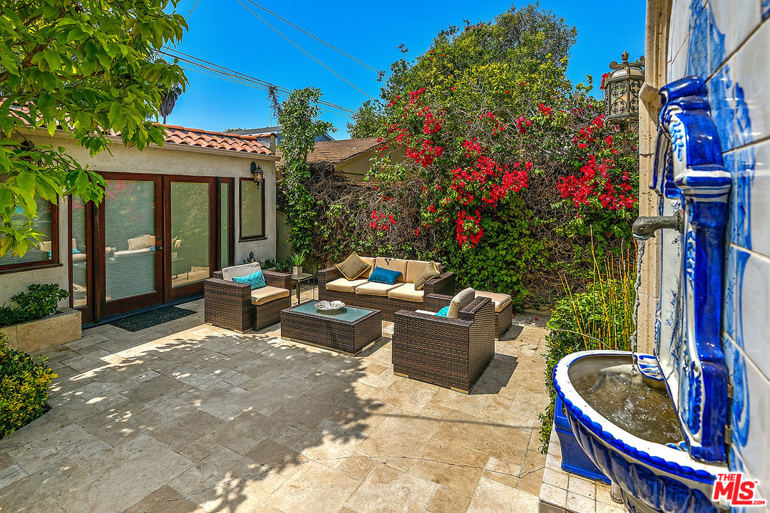 1102 Grant Avenue Venice, CA 90291 - Photo 21 of 29 a backyard of a house with fire pit and outdoor seating